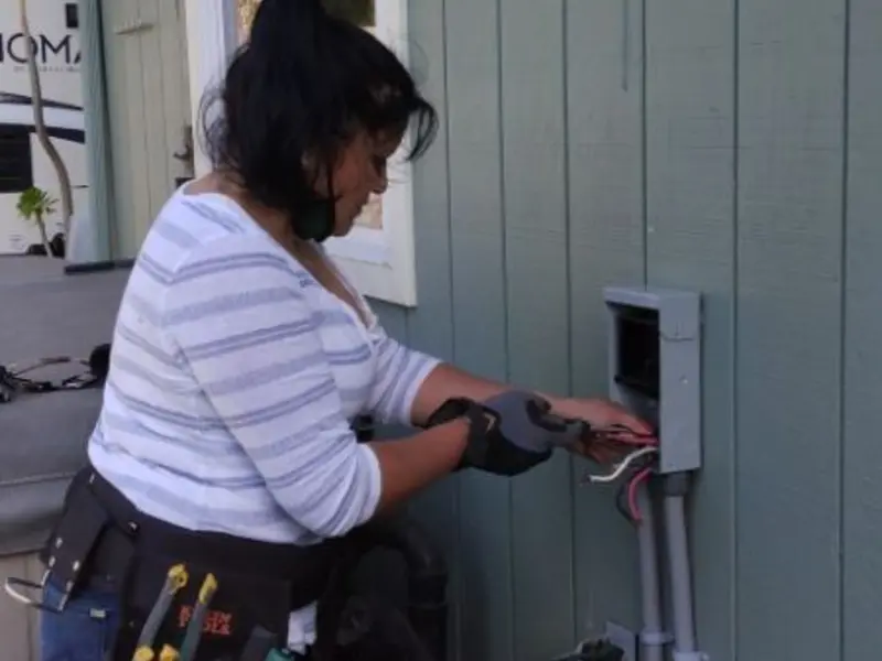 Licensed electrician wiring an exterior subpanel in Virden