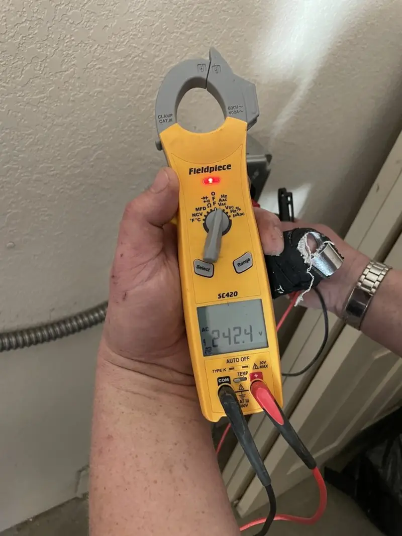 Voltage testing with clamp meter during Outlet Installation in Virden